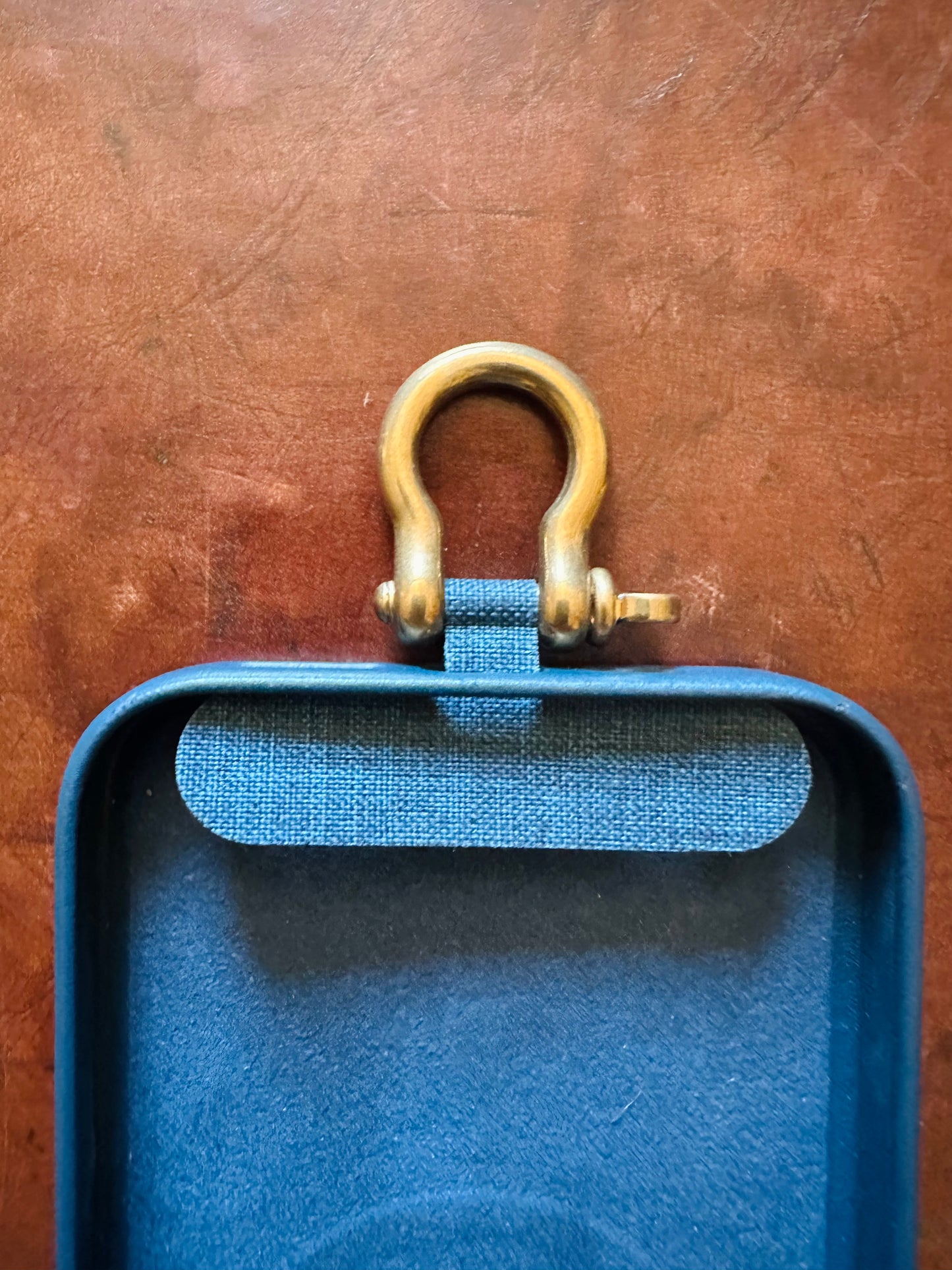 Phone case tether and shackle