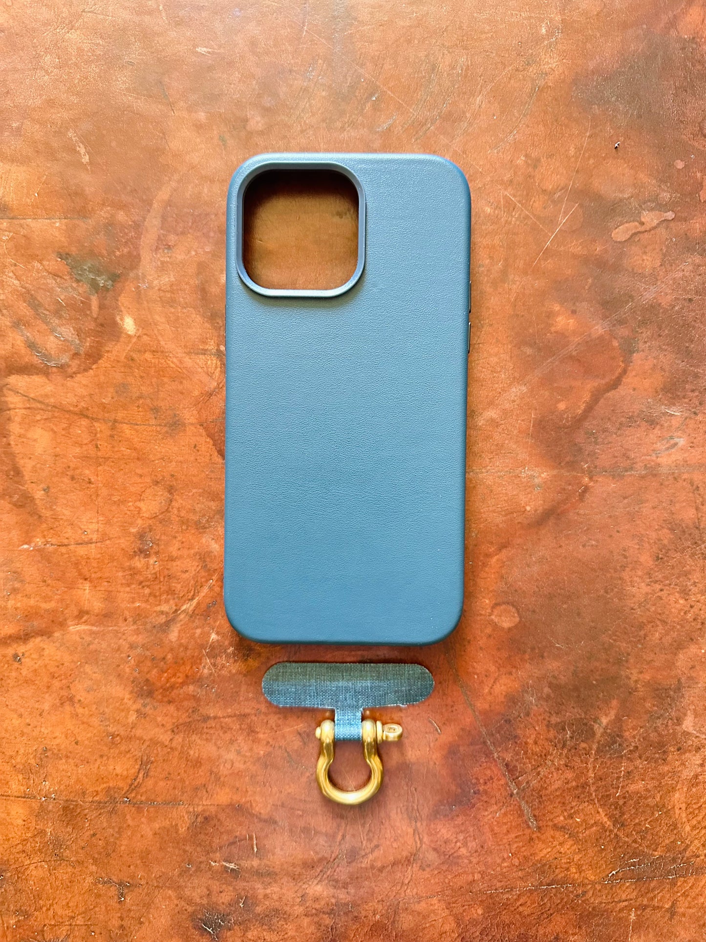 Phone case tether and shackle