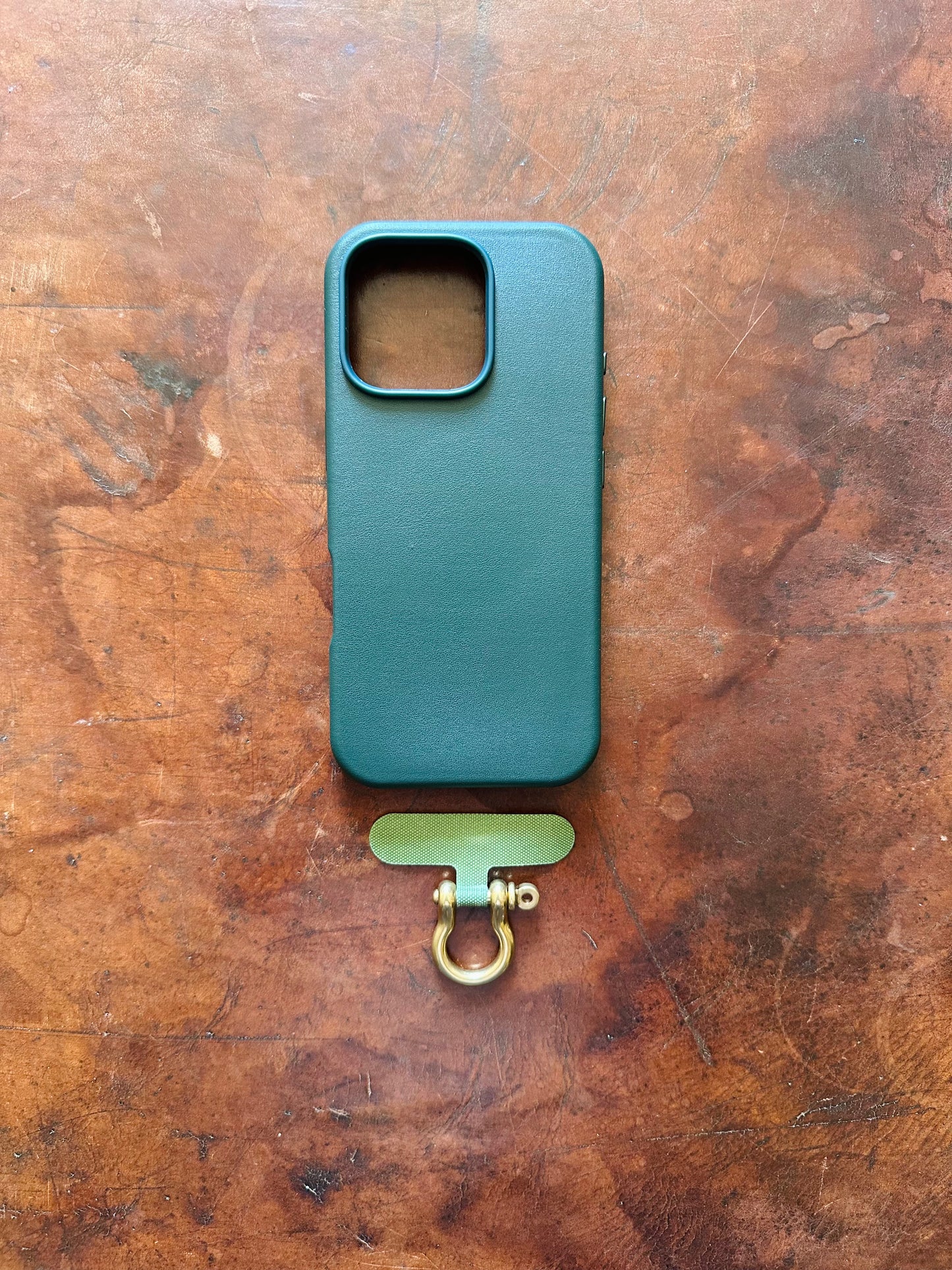 Phone case tether and shackle